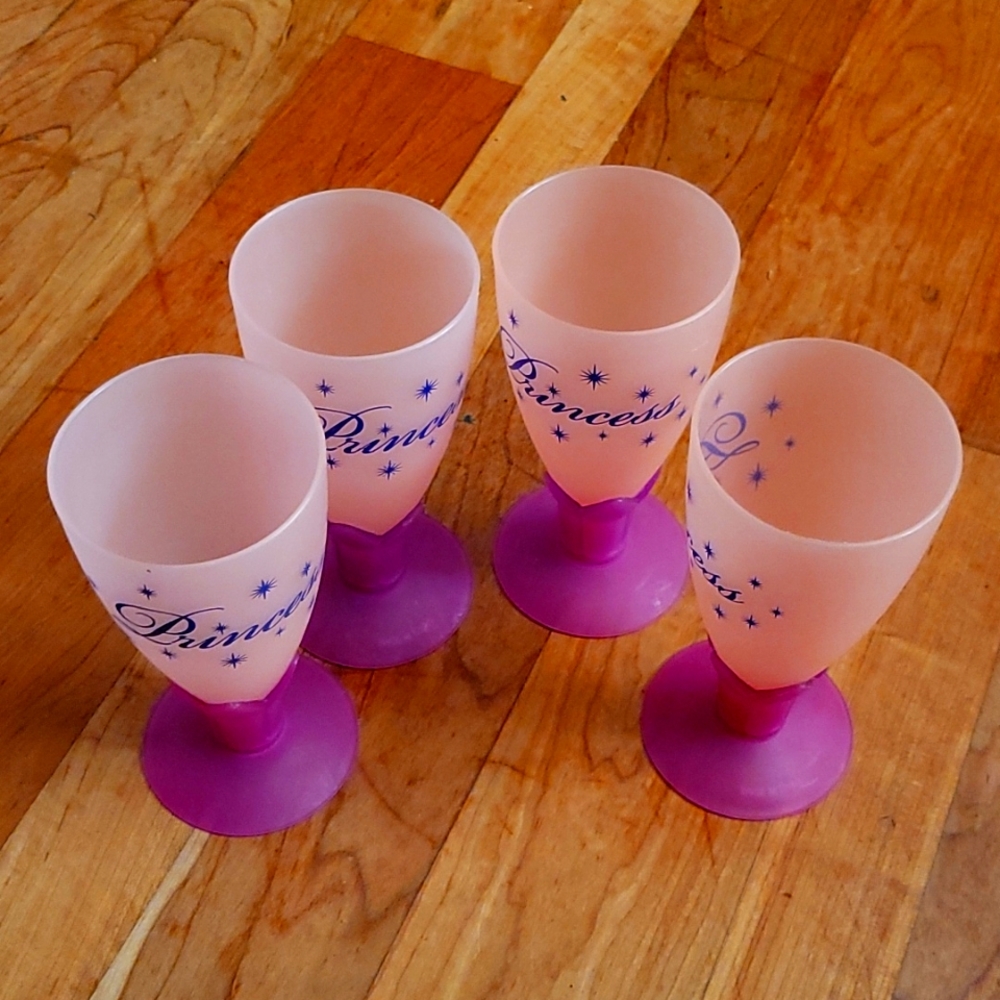 Set of 4 plastic glasses for a little girl's party.